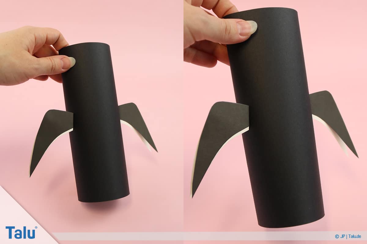 Pinguin basteln mit Kindern, Anleitung, Pinguin aus Papier, Flügel an Papierrolle kleben