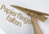 Papierflieger falten